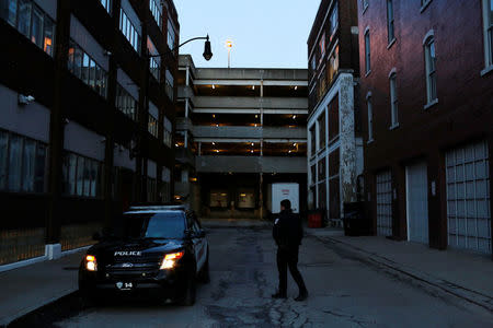 Police officer Pat Galli walks to his vehicle while on patrol in Downtown Binghamton, New York, U.S., April 5, 2018. REUTERS/Andrew Kelly