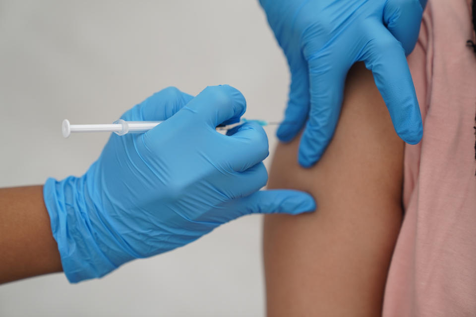 A person receives a Covid-19 jab at a pop-up vaccination centre during a four-day vaccine festival in Langdon Park, Poplar, east London. Picture date: Saturday July 31, 2021. (Photo by Kirsty O'Connor/PA Images via Getty Images)