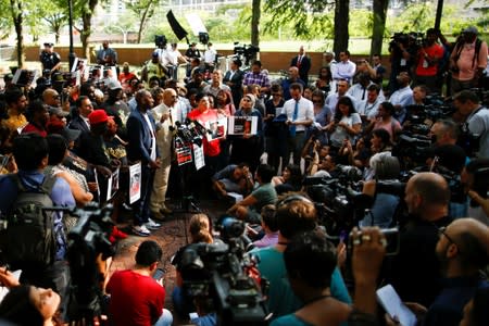 People gather for a press conference of Carr, mother of Eric Garner outside Police Headquarters in New York