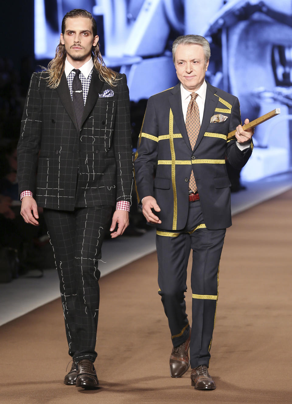 Models wear creations for Etro men's Fall-Winter 2014 collection, part of the Milan Fashion Week, unveiled in Milan, Italy, Monday, Jan. 13, 2014. (AP Photo/Antonio Calanni)