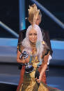 <p>What's this....Gaga stays in one outfit for more than one outfit? It seems she really loved her art-inspired gown - here she is wearing it as she accepts the award for Best Female Video.</p>