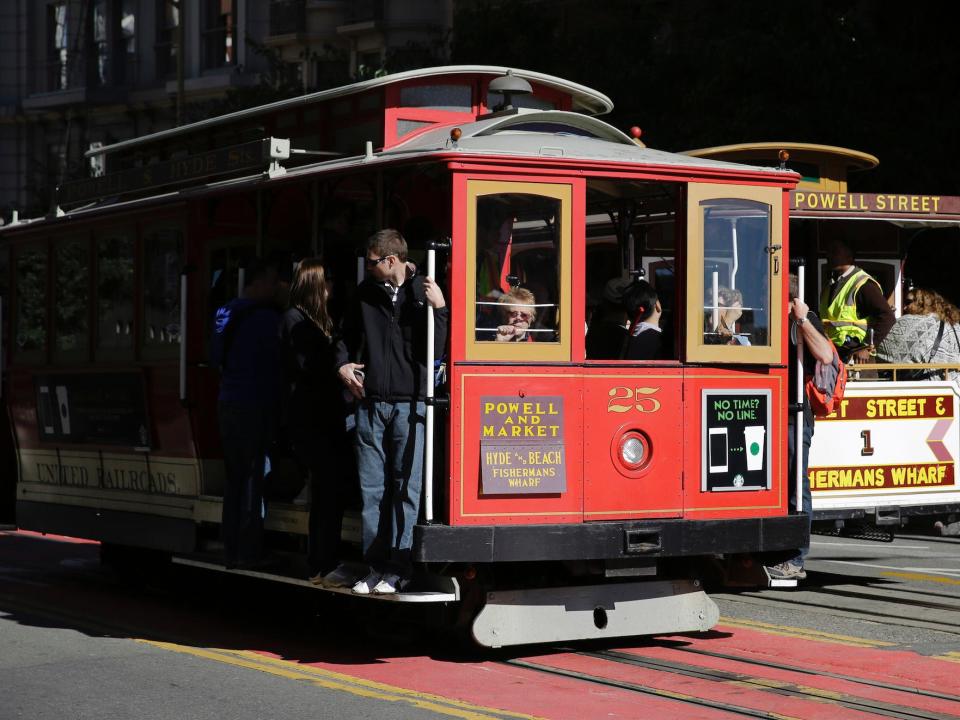 A pair of cable cars go past each other on Powell Street atop Nob Hill in San Francisco.