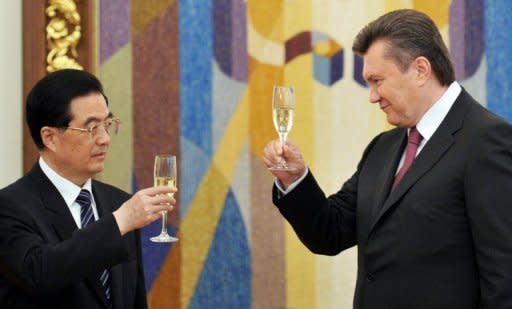 Ukrainian president Viktor Yanukovych (right) and his Chinese counterpart Hu Jintao make a toast after signing ceremony in Kiev. Hu was on a rare visit to Ukraine to sign a strategic partnership declaration as Beijing seeks to revive ties with the ex-Soviet state after years of neglect
