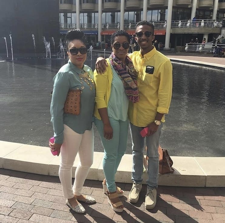 In this family photo provided Jahmar Thomas, from left, Nikiesha Thomas, her mother Nadine Thomas, and brother Jahmar Thomas, pose for a photo on Mother's Day, May 8, 2016, in the Georgetown area of Washington. Nikiesha Thomas was shot and killed by her ex-boyfriend just days after filing for a protective order last October. Victims of abuse and their families saw a quiet breakthrough this summer when the passage of a bipartisan gun safety bill in Congress included a proposal that would make it more difficult for intimate partners of convicted domestic abusers to obtain firearms. (Jahmar Thomas via AP)