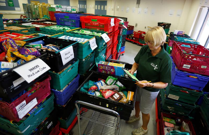 Christine Manning, a volunteer at the charity Greenwich Foodbank, prepares food packages