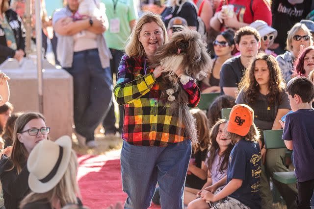 <p>Courtesy of World's Ugliest Dog</p> Wild Thang is carried by his owner, Ann Lewis