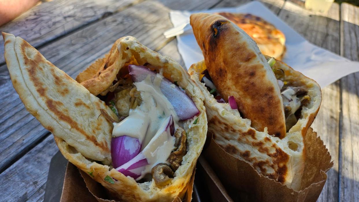 Yalla, a Middle Eastern cuisine food truck, offers Sabich, also called "Cloud in a Pita" made with caramelized eggplant, chopped salad, egg, beet cream, pickled onion and tahini.