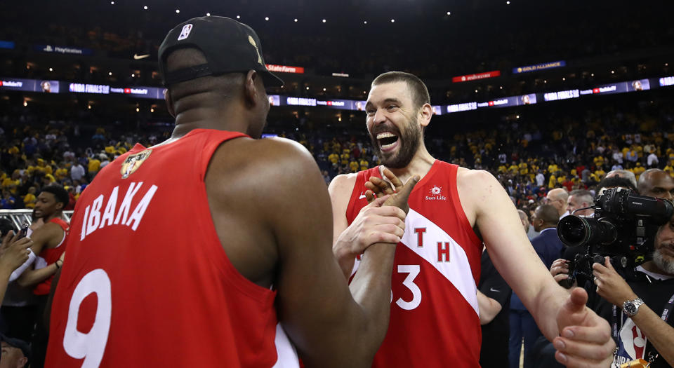 OAKLAND, CALIFORNIA - JUNE 13:  Serge Ibaka #9 and Marc Gasol #33 of the Toronto Raptors celebrates their teams victory over the Golden State Warriors in Game Six to win the 2019 NBA Finals at ORACLE Arena on June 13, 2019 in Oakland, California. NOTE TO USER: User expressly acknowledges and agrees that, by downloading and or using this photograph, User is consenting to the terms and conditions of the Getty Images License Agreement. (Photo by Ezra Shaw/Getty Images)