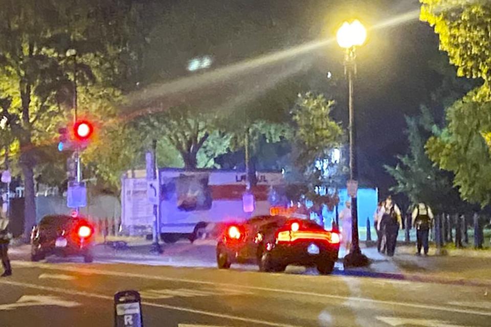 A box truck is seen crashed into a security barrier at a park across from the White House, Monday night, May 22, 2023, in Washington D.C. Police have arrested a man they believe intentionally crashed a U-Haul truck into a security barrier near the north side of Lafayette Square late Monday night. No one was injured. (Benjamin Berger via AP)