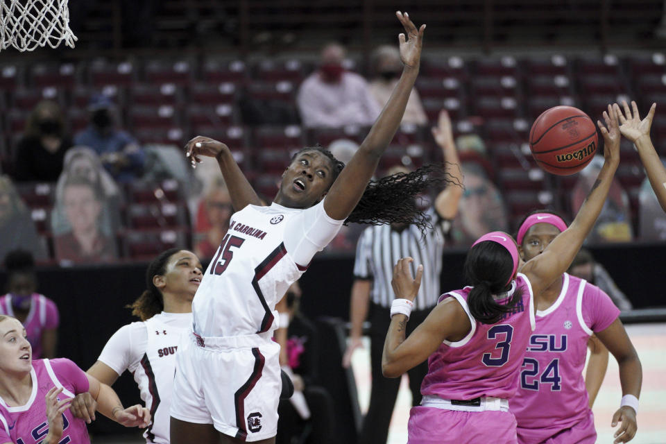 South Carolina forward Laeticia Amihere (15) battles for a rebound against LSU guard Khayla Pointer (3) during the first half of an NCAA college basketball game Sunday, Feb. 14, 2021, in Columbia, S.C. (AP Photo/Sean Rayford)