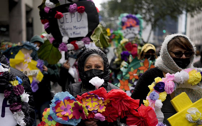 Social movement demonstrators hold a mock funeral procession in Buenos Aires, Argentina