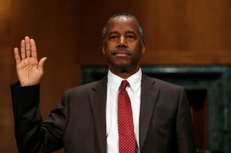 Dr. Ben Carson is sworn in to testify before a Senate Banking, Housing and Urban Affairs Committee confirmation hearing on his nomination to be Secretary of the U.S. Department of Housing and Urban Development on Capitol Hill in Washington, U.S. January 12, 2017. REUTERS/Kevin Lamarque