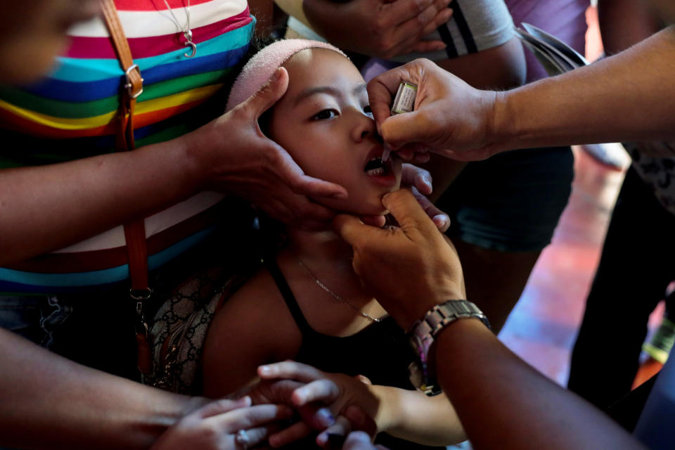 A child receives free polio vaccine during a government-led mass vaccination program in Quezon City, Metro Manila, Philippines, October 14, 2019. REUTERS/Eloisa Lopez