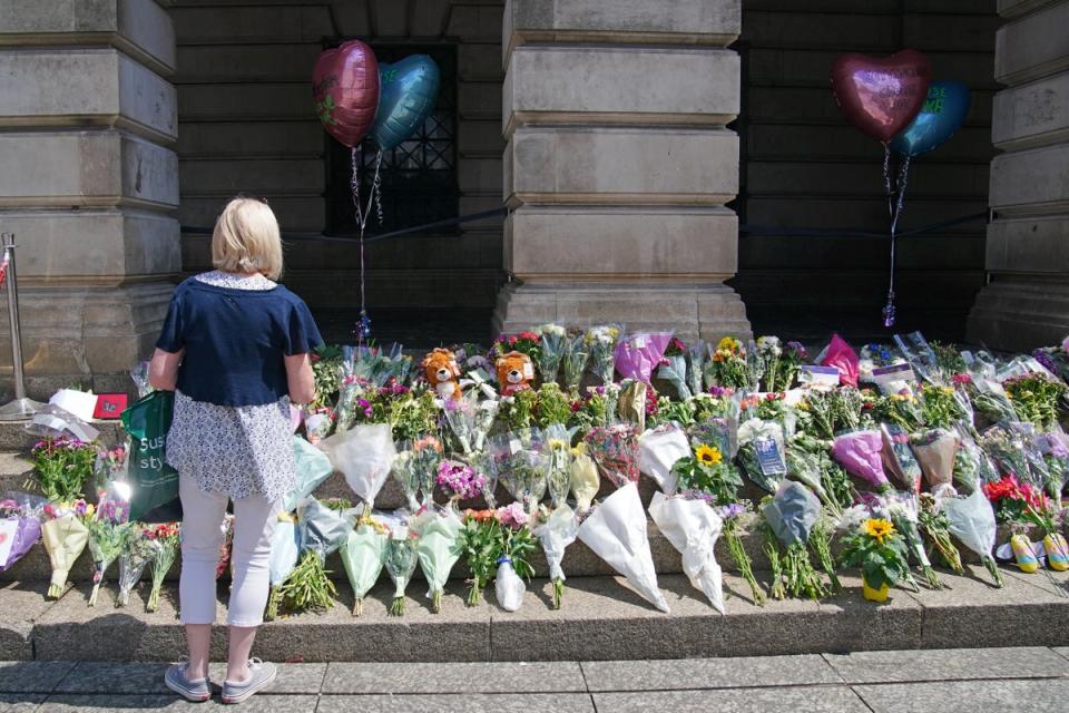 Flowers have been left on the steps of Nottingham Council House after three people were killed and another three hurt in connected attacks on Tuesday (Peter Byrne/PA Wire)