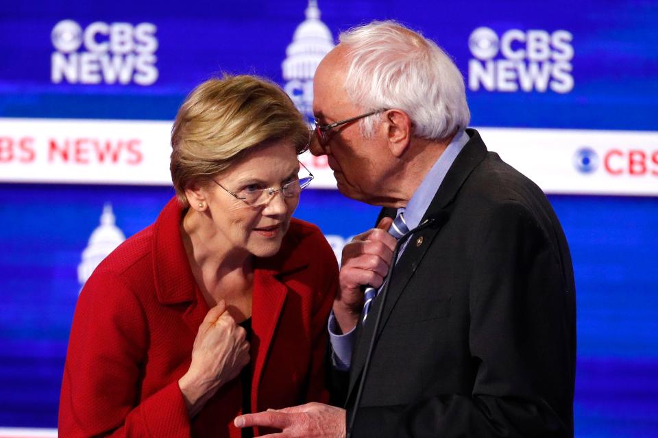 Elizabeth Warren and Bernie Sanders after a Democratic presidential primary debate in Charleston, South Carolina, on Feb. 25, 2020.