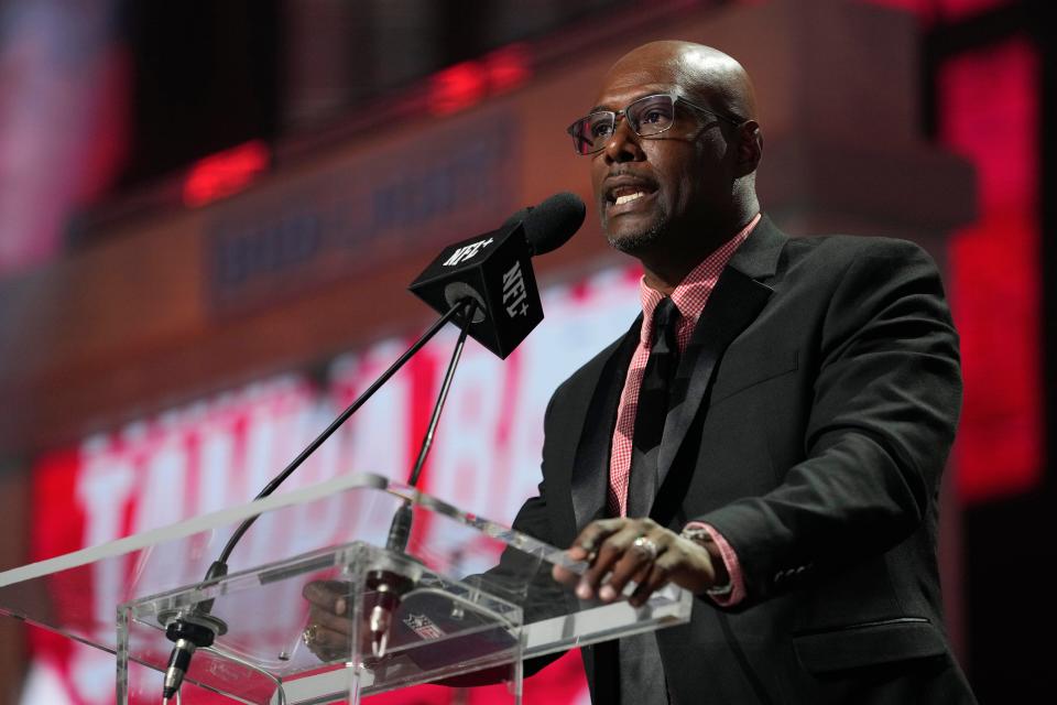 Dexter Jackson announces the No. 82 pick for the Tampa Bay Buccaneers at the 2023 NFL football draft, Friday, April 28, 2023, in Kansas City, Mo. The Buccaneers picked Louisville defensive end YaYa Diaby. (AP Photo/Steve Luciano)