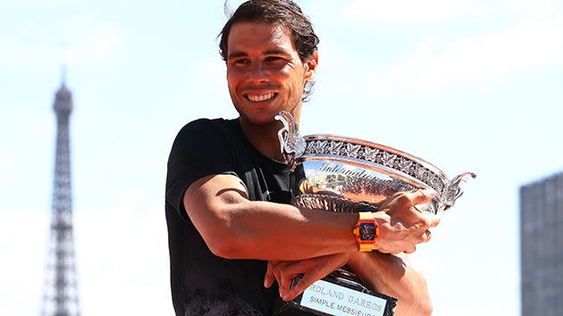 Nadal shows off his new silverware. Image: Getty