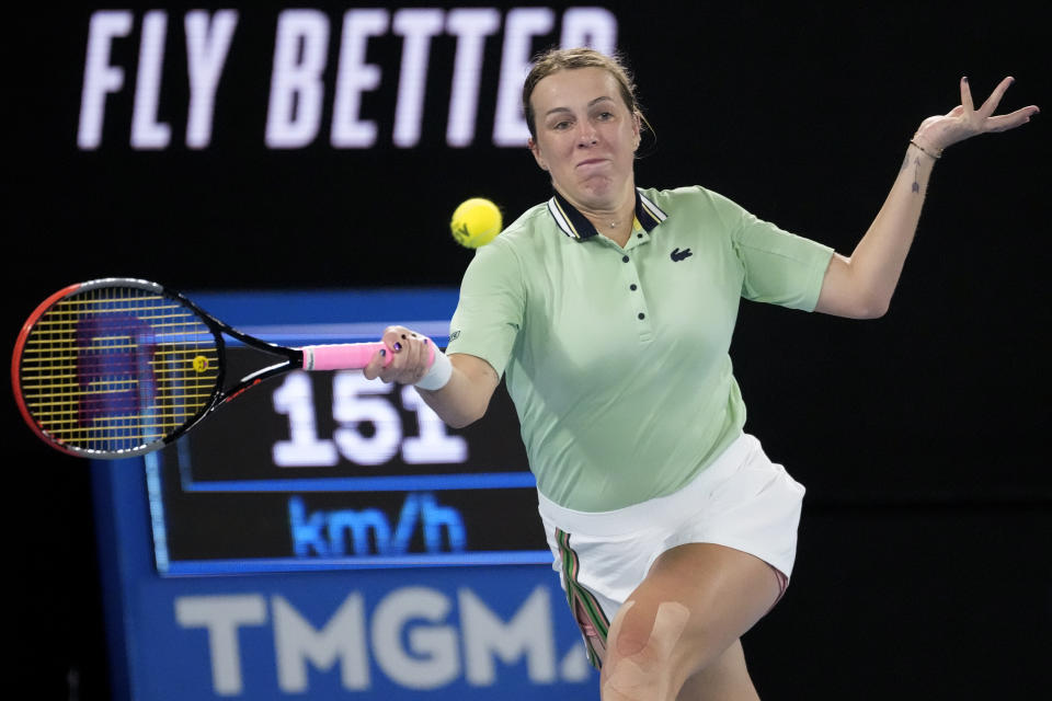 Anastasia Pavlyuchenkova of Russia plays a forehand return to Sorana Cirstea of Romania during their third round match at the Australian Open tennis championships in Melbourne, Australia, Saturday, Jan. 22, 2022. (AP Photo/Simon Baker)