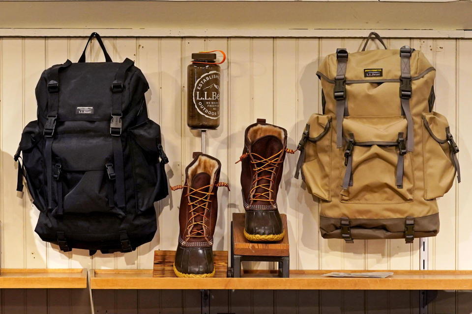 Backpacks and Bean Boots are displayed at the L.L. Bean flagship retail store, Thursday, March 18, 2021, in Freeport, Maine. Maine-based retailer L.L. Bean saw the best sales in nearly a decade during pandemic. Officials say the Freeport-based retailer started its fiscal year with store closings and worries about survival but the company weathered the turbulent times to revenue growth of 5%. (AP Photo/Robert F. Bukaty)