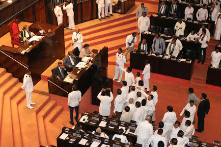 Sri Lanka's parliament members argue in front of Speaker of the Parliament Karu Jayasuriya during the parliament session in Colombo, Sri Lanka November 14, 2018. REUTERS/Stringer