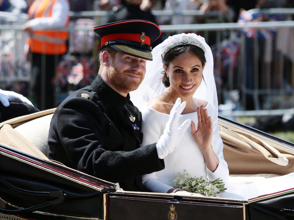 meghan markle and prince harry in their wedding carriage