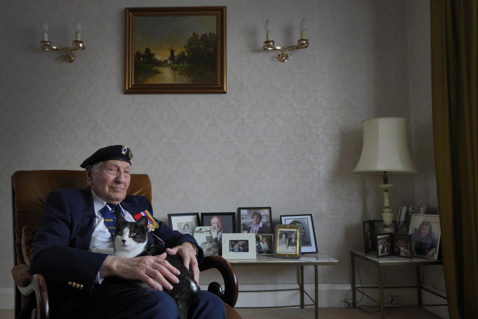 Mervyn Kersh D-Day veteran who fought in the Normandy Campaign, with his cat Joey at his home in London, Monday, April 8, 2024. A Jewish veteran is preparing to commemorate the 80th anniversary of the D-Day landings. Pvt. Mervyn Kersh was summoned by his commanding officer and threatened with arrest even as he prepared to embark for the battlefields of Normandy eight decades ago. (AP Photo/Kirsty Wigglesworth)