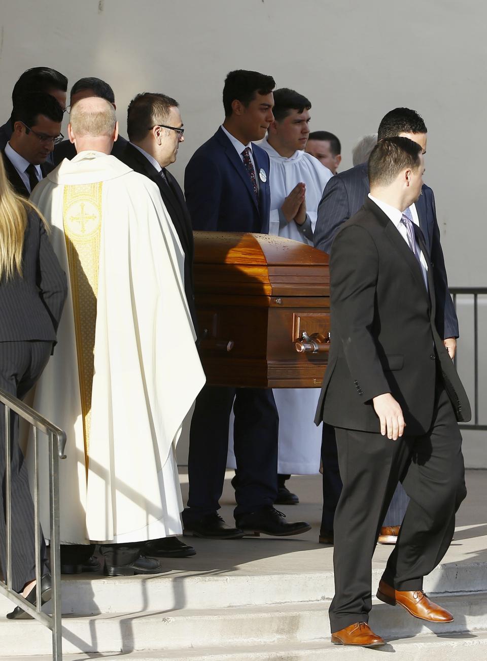 Pall bearers take the casket of former Democratic U.S. Rep. Ed Pastor back to the hearse after a funeral Friday, Dec. 7, 2018, in Phoenix. Pastor was Arizona's first Hispanic member of Congress, spending 23 years in Congress before retiring in 2014. Pastor passed away last week at the age of 75. (AP Photo/Ross D. Franklin)