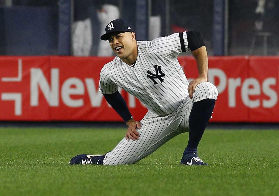 Jun 18, 2019; Bronx, NY, USA; New York Yankees right fielder Giancarlo Stanton (27) stretches prior to the game against the Tampa Bay Rays at Yankee Stadium. Mandatory Credit: Andy Marlin-USA TODAY Sports