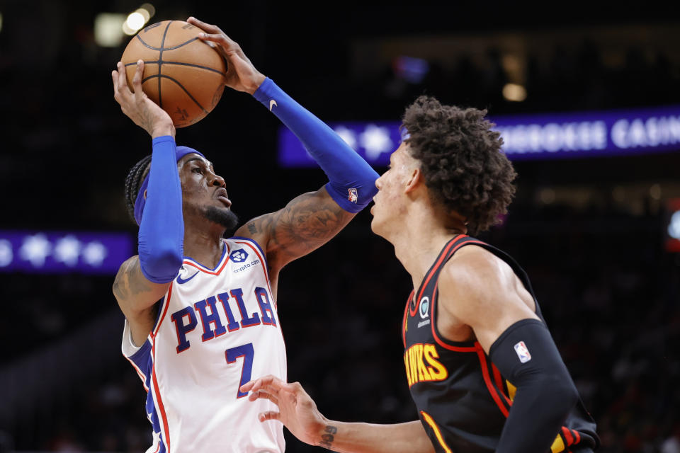 Philadelphia 76ers forward Jalen McDaniels, left, drives against Atlanta Hawks forward Jalen Johnson during the second half of an NBA basketball game Friday, April 7, 2023, in Atlanta. (AP Photo/Alex Slitz)