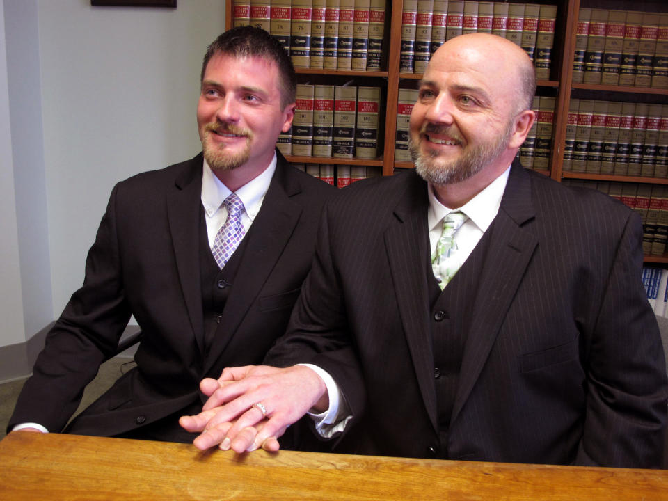 Longtime Cincinnati couple Karl Rece Jr., left, and Gary Goodman speak to media at a law firm in Cincinnati, Wednesday, April 30, 2014. They are among 12 plaintiffs named in a Wednesday lawsuit seeking to strike down Ohio's gay marriage ban and allow same-sex couples to marry in the state. (AP Photo/Amanda Lee Myers)