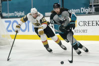 San Jose Sharks defenseman Erik Karlsson, right, skates in front of Vegas Golden Knights right wing Reilly Smith (19) during the second period of an NHL hockey game in San Jose, Calif., Saturday, March 6, 2021. (AP Photo/Jeff Chiu)
