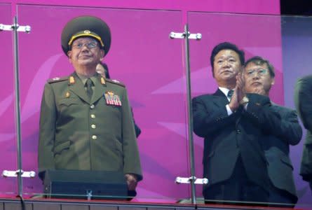 FILE PHOTO: North Korea's Hwang Pyong So (L), a senior aide North Korea's supreme leader Kim Jong Un, attends the closing ceremony of the 17th Asian Games at the Incheon Asiad Main Stadium, October 4, 2014. REUTERS/Jason Reed/File Photo