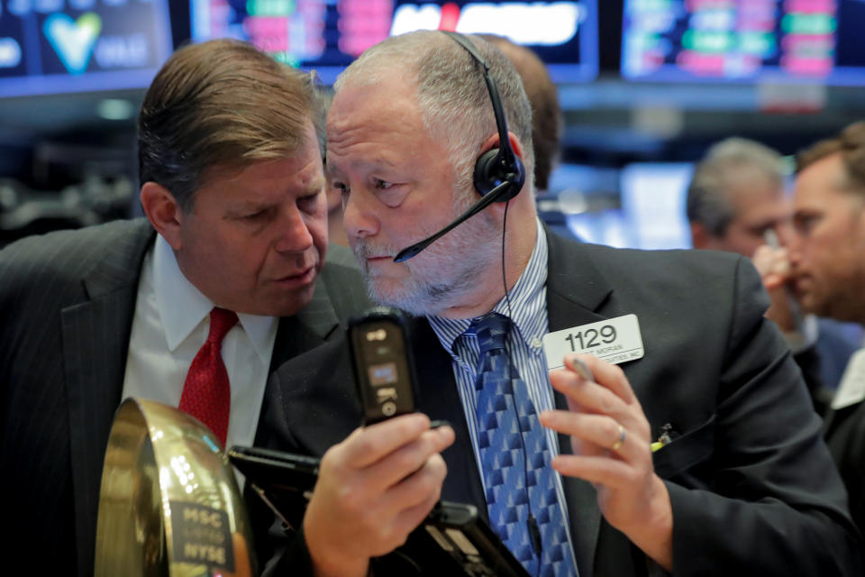 Traders work on the floor of the New York Stock Exchange (NYSE) in New York, U.S., October 18, 2018. REUTERS/Brendan McDermid