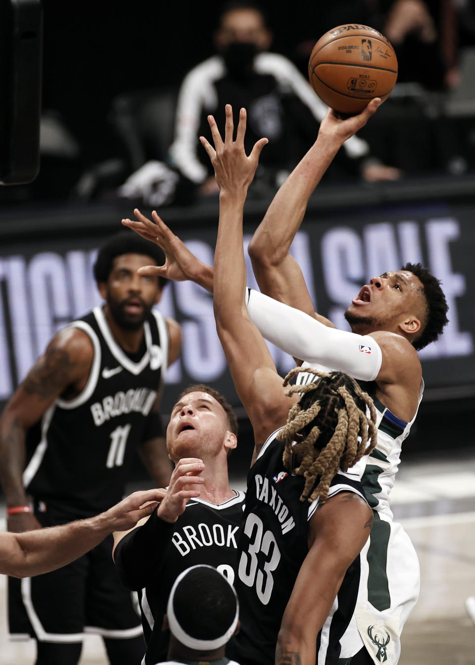 Milwaukee Bucks forward Giannis Antetokounmpo shoots over Brooklyn Nets forward Nicolas Claxton (33) during the first half of Game 1 of an NBA basketball second-round playoff series Saturday, June 5, 2021, in New York. (AP Photo/Adam Hunger)