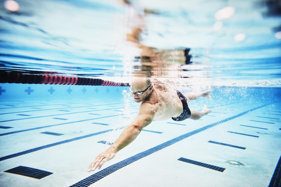 A male triathlete does a swim workout for 70.3 training