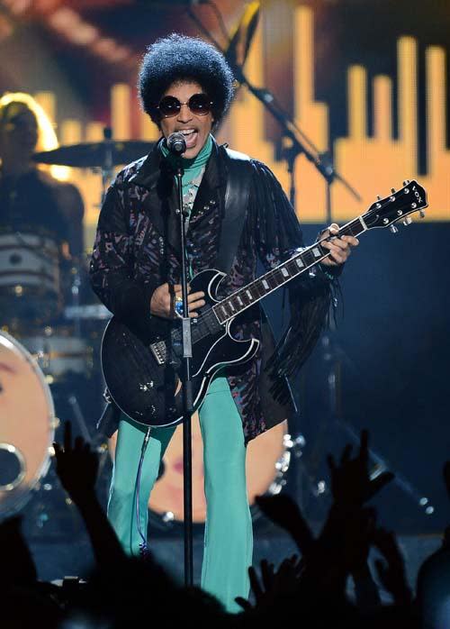 Prince at the billboard music awards in a tasseled leather jacket, and emerald green leggings.