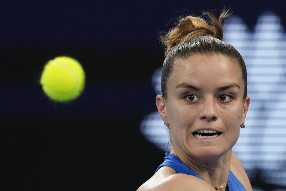 Maria Sakkari of Greece plays a backhand return to Germany's Angelique Kerber during their United Cup quarterfinal tennis match in Sydney, Australia, Friday, Jan. 5, 2024. (AP Photo/Mark Baker)