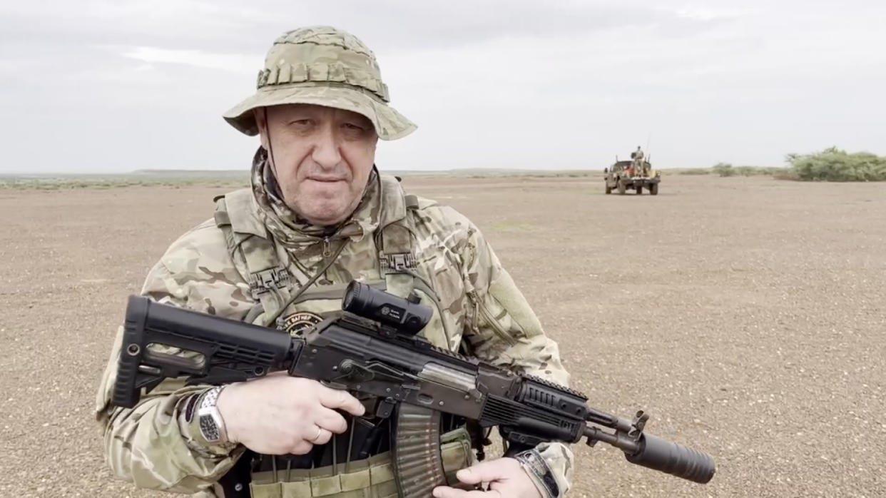 UNSPECIFIED LOCATION IN AFRICA - AUGUST 21: (----EDITORIAL USE ONLY - MANDATORY CREDIT - 'WAGNER TELEGRAM ACCOUNT / HANDOUT' - NO MARKETING NO ADVERTISING CAMPAIGNS - DISTRIBUTED AS A SERVICE TO CLIENTS----) A screen grab captured from a video shared online shows Yevgeny Prigozhin, the founder of the Russian private security company Wagner, holding a rifle in a desert area while wearing camouflage in a video for the first time after his rebellion against the Russian administration in an unspecified location in Africa on August 21, 2023. In the footage shared on the Telegram channel 'Wagner's evacuation', Prigozhin stated that they have made Russia 'even greater' on all continents, including Africa. (Photo by Wagner Account/Anadolu Agency via Getty Images)