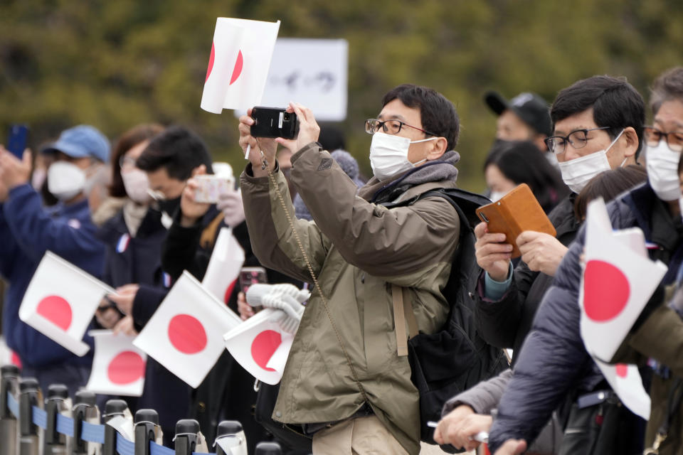 Well-wishers wait to see Japan's Emperor Naruhito during his 63rd birthday celebration at the Imperial Palace in Tokyo, Thursday, Feb. 23, 2023. (AP Photo/Eugene Hoshiko, Pool)