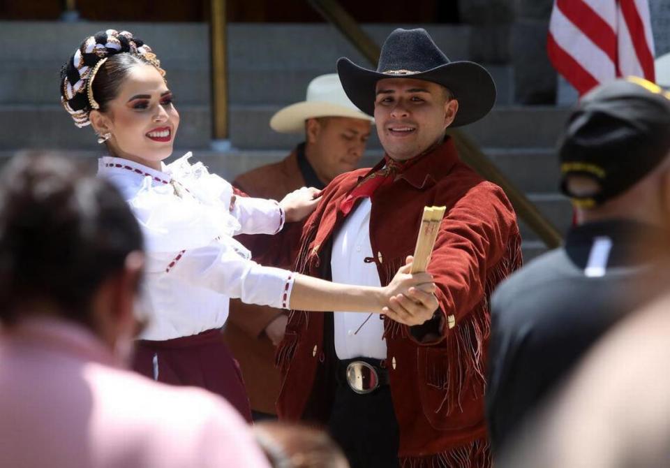 Ballet Folklórico Guadajalara performs a polka from northern México during its participation at the Memorial Day ceremony at Courthouse Park in Madera on May 29, 2023.