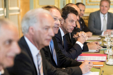 President of Medef (French employers' association), Geoffroy Roux de Bezieux, center, attends with other union representatives a meeting with French President Emmanuel Macron, at the presidential Elysee palace in Paris, France, Tuesday July 17, 2018. Jean-Francois Badias/Pool via Reuters