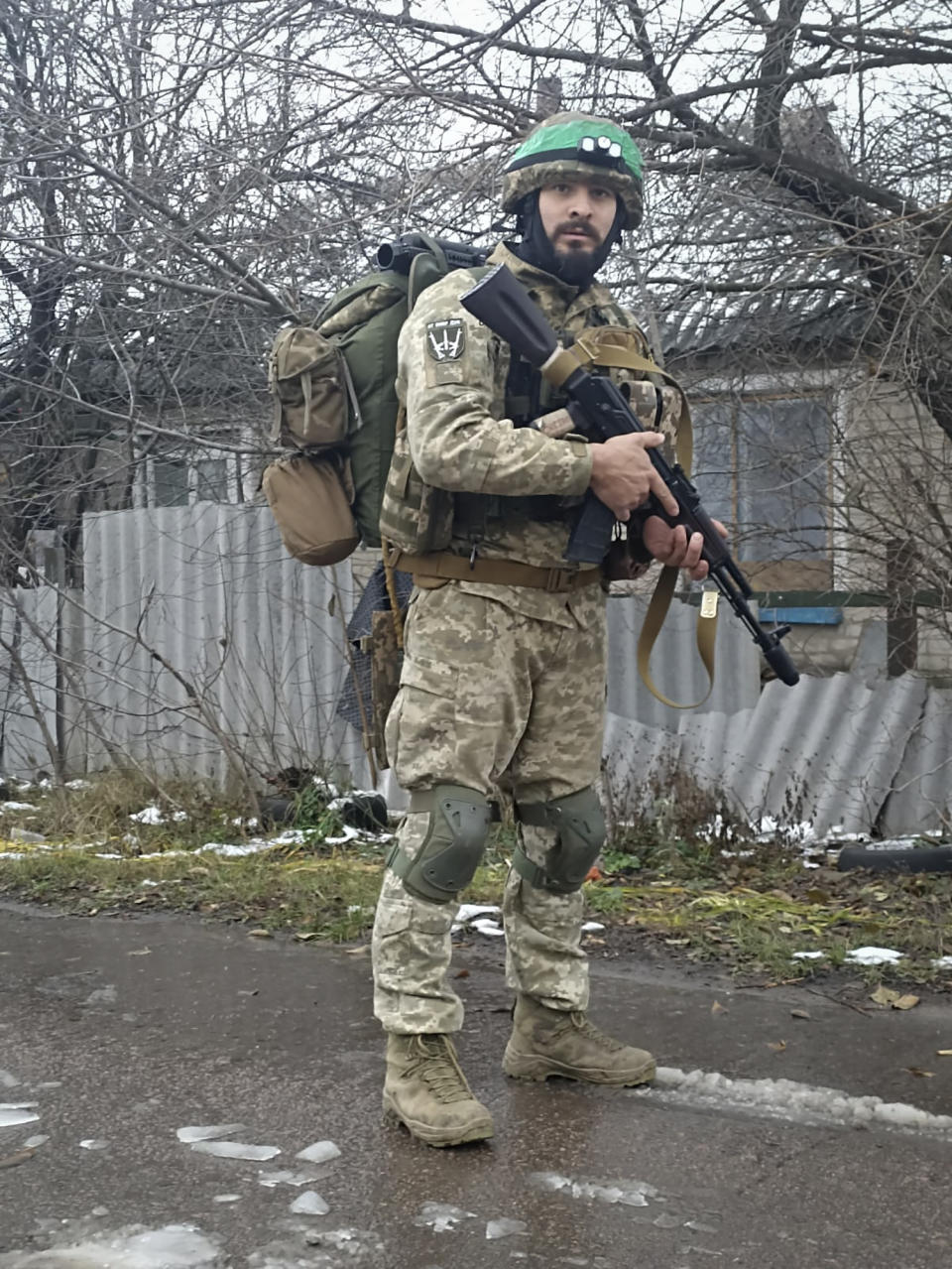 This 2023 photo provided by a 32-year-old professional soldier from Medellín, Colombia who goes by the call sign Checho shows him in his combat gear in Donbas, eastern Ukraine. Checho says he was struck by fire from a drone during a rescue operation to save a wounded colleague on the front line after three days of heavy fighting with Russian forces. At the hospital in the Kyiv region, Checho found himself with more than fifty other Colombians, most with light injuries sustained while fighting Russian occupation forces in eastern Ukraine’s Donetsk region. They are among hundreds of Colombian veterans who have made the journey to Ukraine to help its forces fight the Russians. (Courtesy of Checho via AP)