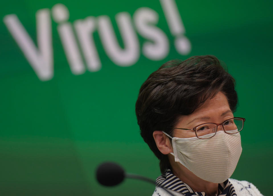 Hong Kong Chief Executive Carrie Lam listens to journalists questions during a press conference in Hong Kong, Monday, July 13, 2020. Hong Kong on Monday introduced more stringent social-distancing measures, banning public gatherings of more than four and making it compulsory to wear a mask on public transport as the city battles a fresh outbreak of locally-transmitted coronavirus infections. (AP Photo/Wally Santana)