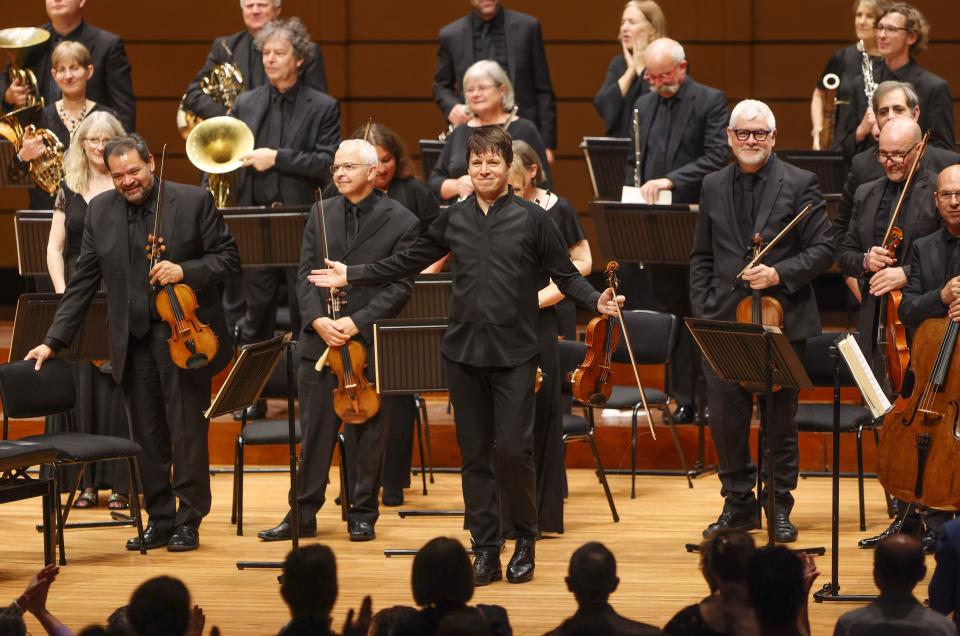 Joshua Bell, center, stands with other members of the Academy of St. Martin of the Fields orchestra. Bell, who grew up in Bloomington, returns as music director of the chamber orchestra for a performance on March 26, 2024, at IU Auditorum.