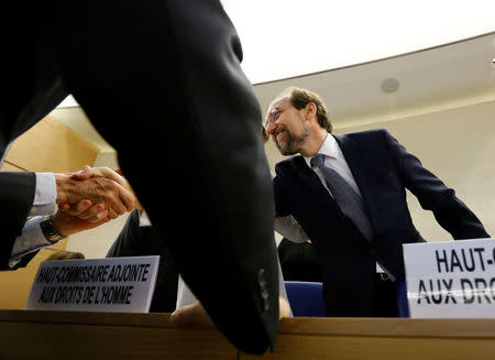 Zeid Ra'ad Al Hussein, U.N. High Commissioner for Human Rights (R) shakes hand with an unidentified delegate before the 36th Session of the Human Rights Council at the United Nations in Geneva, Switzerland September 11, 2017. REUTERS/Denis Balibouse