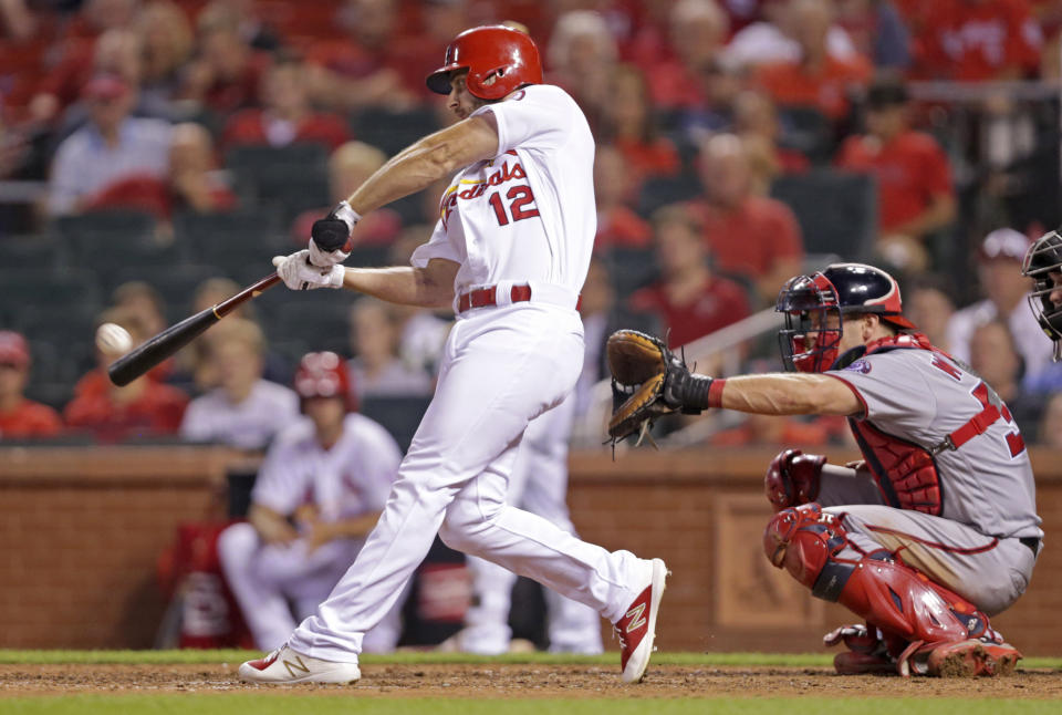 St. Louis Cardinals' Paul DeJong (12) connects for a walk-off home run, as Washington Nationals catcher Matt Wieters looks on, in the ninth inning of a baseball game, Monday, Aug. 13, 2018, in St. Louis. The Cardinals defeated the Nationals 7-6. (AP Photo/Tom Gannam)