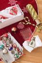 <p>Once you get your liquor-store boxes (or what-have-you), layer two to three ornaments wrapped in tissue paper into each slot, placing heavier ones on the bottom.</p>