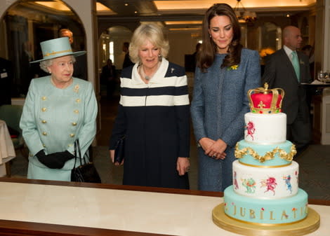 The royal women admire a Diamond Jubilee-themed cake