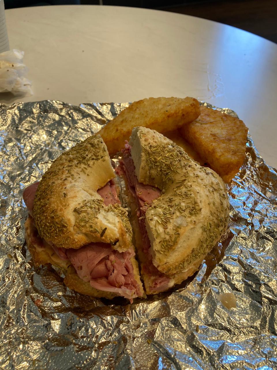 The Rueben on a rosemary sea salt bagel with a side of hash browns from Cleveland Bagel Café in Kent.