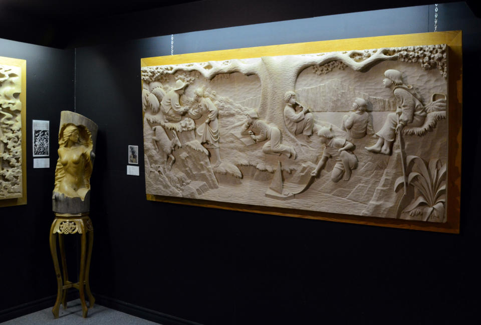 In this photo taken Aug. 16, 2013, a carved wood relief sculpture is displayed in a museum in Saint-Jean-Port-Joli, in Quebec. The lively town is along the Route Verte bicycle network that covers more than 3,000 miles in Quebec. (AP Photo/Calvin Woodward)